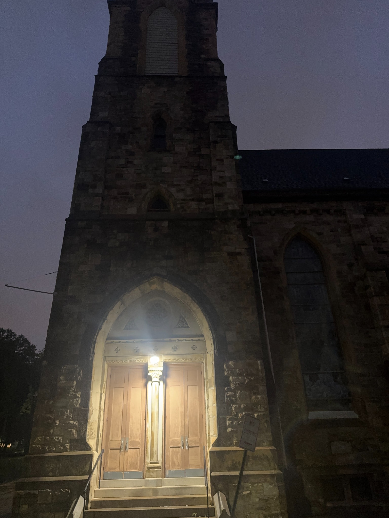 Stone church tower at night